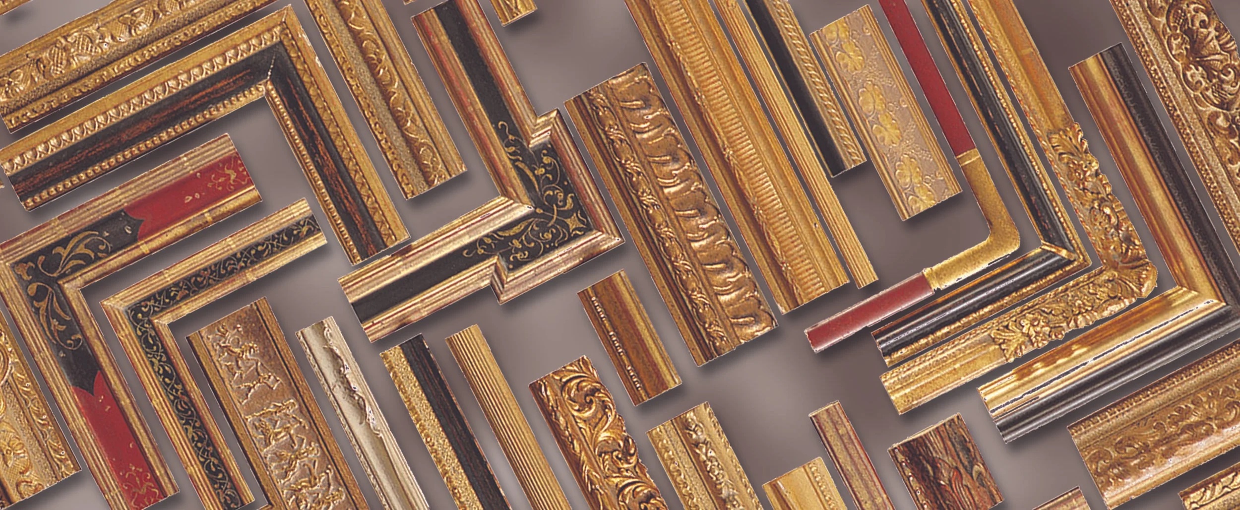 A wide selection of ornate gold, silver, and black frame moulding samples